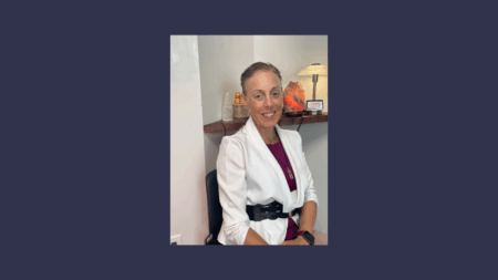 Smiling professional woman seated in office