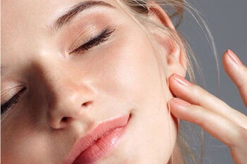 Close-up beauty portrait of woman with glowing skin
