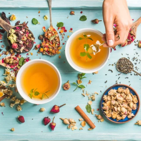 Two cups of herbal tea with dried flowers